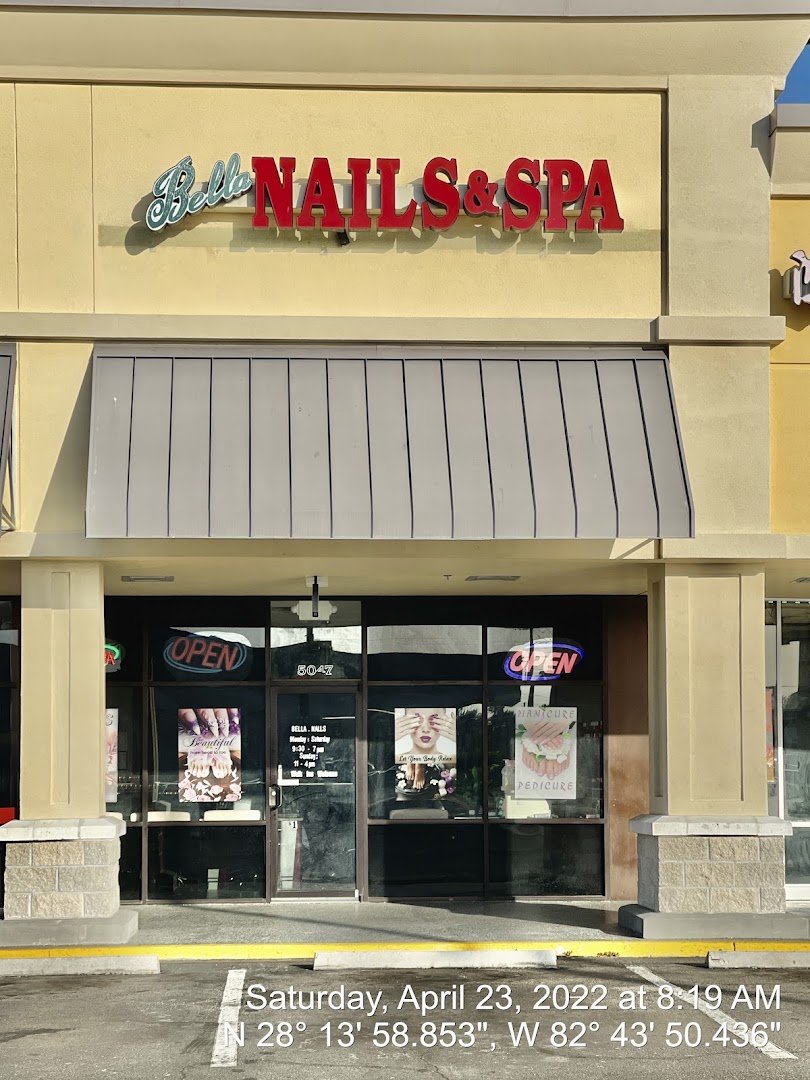 Rows of nail polish colors beside manicure stations.